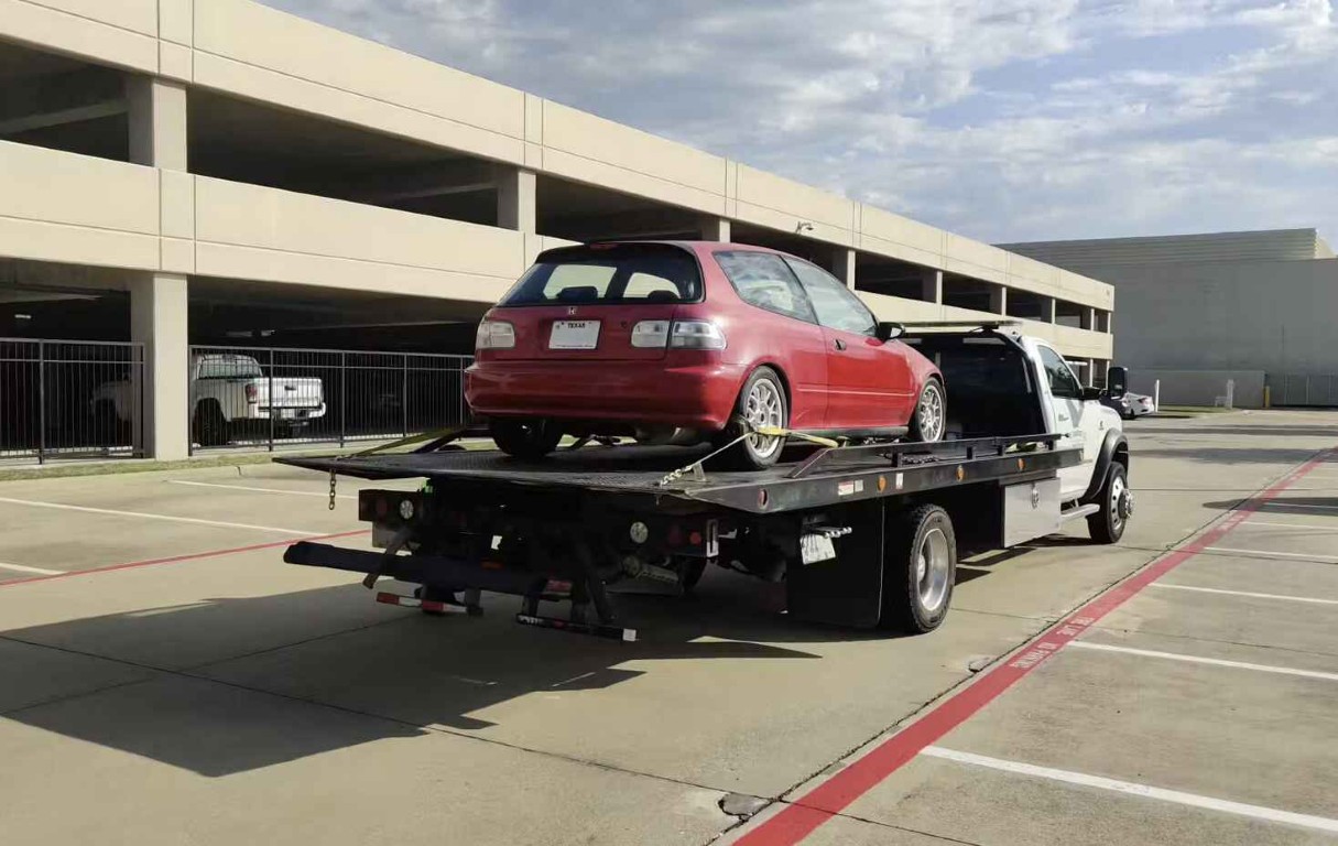 Junk car removal and towing service in parking structure in Encinitas, CA