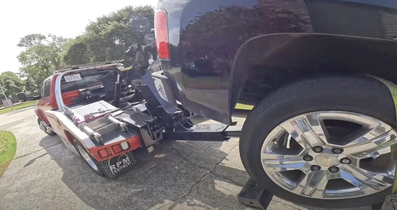 Safe motorcycle and vehicle loading process on tow truck in Encinitas, CA